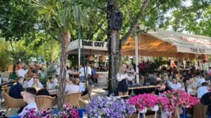 A captivating live violin performance in the modern Time Out cafe on Ada Ciganlija, Belgrade, which features an upscale garden restaurant and an exclusive beach bar area with luxury day beds and cabanas.