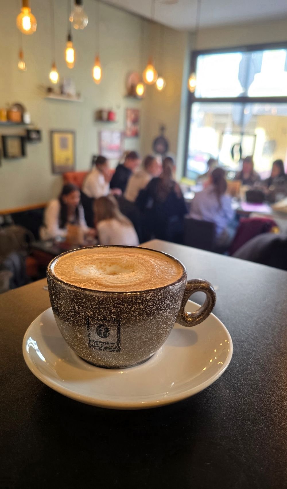 Unique cafe table filled with roasted coffee beans under glass in Belgrade
